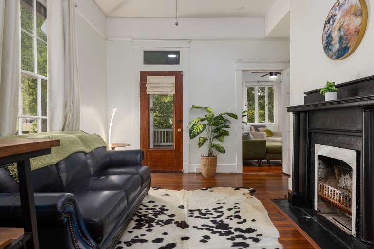 Enjoy the comfort of our sofa bed, and utilize the table with bar seats as your private workspace for ultimate convenience. Enjoy the comfort of our sofa bed, and utilize the table with bar seats as your private workspace for ultimate convenience.