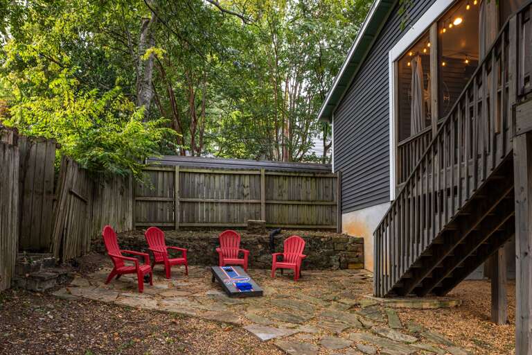 Make the most of our backyard, complete with cornhole and comfortable outdoor seating for endless fun and relaxation. Make the most of our backyard, complete with cornhole and comfortable outdoor seating for endless fun and relaxation.