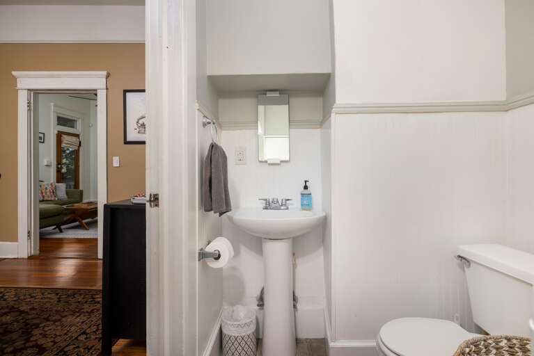 Convenient half bath adjacent to the dining room for easy access. Convenient half bath adjacent to the dining room for easy access.