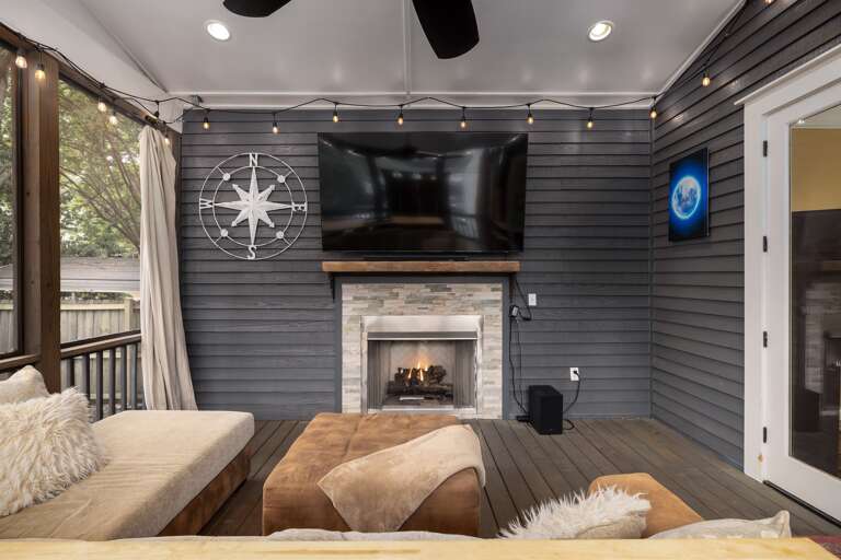 Experience the best of both worlds on our screened-in porch: a large flatscreen TV and a cozy gas fireplace for entertainment and comfort. Experience the best of both worlds on our screened-in porch: a large flatscreen TV and a cozy gas fireplace for entertainment and comfort.