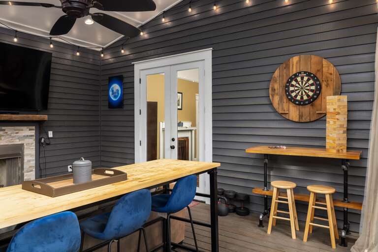 Enjoy the screened-in porch directly off the dining room, featuring bar seating for an al fresco dining experience. Enjoy the screened-in porch directly off the dining room, featuring bar seating for an al fresco dining experience.