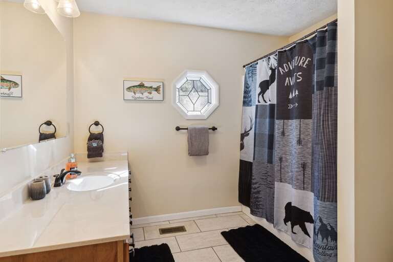 Indulge in relaxation and comfort in our generously sized bathroom with a long vanity!