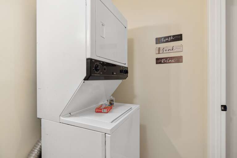 The washer/dryer combo is conveniently located in the second bathroom upstairs.
