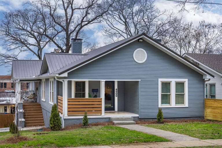 Step up to your charming retreat: The home's front boasts a beautiful, welcoming entrance to begin your stay.