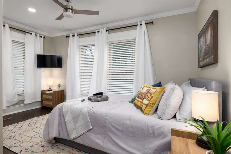 Dream Easy: Restful bedrooms featuring comfortable beds and comfy linens to ensure a peaceful night's sleep. We have a TV in every room!