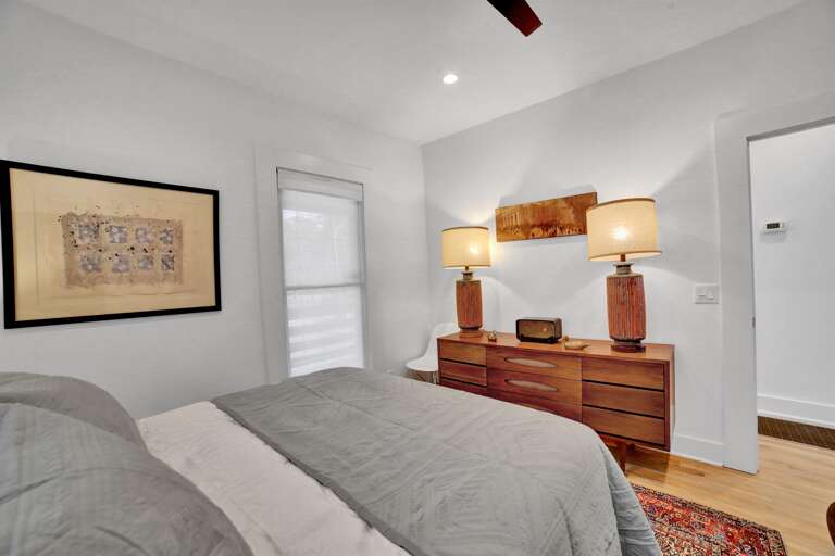 Cozy up in this snug spot with warm lamp light adding a soft glow. We even have a dresser, to help you keep things tidy.