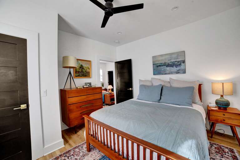 **Cozy Queen Space**: Chill vibes with a peaceful blue comforter and plenty of dresser room to stash your stuff. Pure comfort zone!