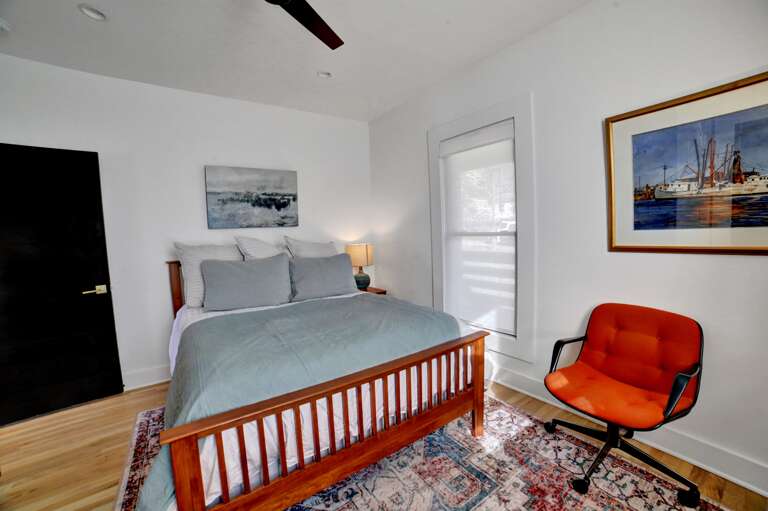 **Queen Bedroom Comfort**: This view emphasizes the bedroom's serene and inviting nature, highlighting a plush queen bed that promises restful slumber and ultimate relaxation.