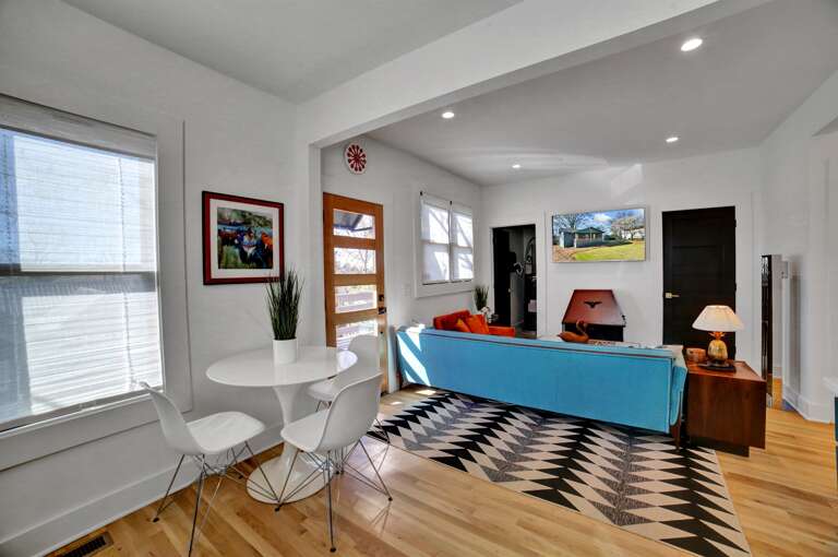 **Open-Plan Harmony**: The kitchen dining area offers a seamless flow into the living room, perfect for gatherings and shared moments.