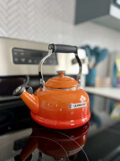 **Tea Time**: The tea kettle stands ready for a soothing brew, marking its own cozy corner in the kitchen.
