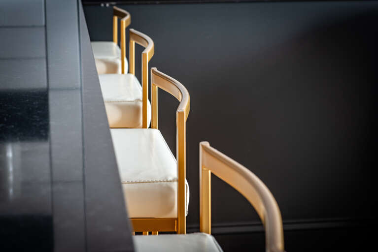 Gather for memorable meal times or lively conversations around our stylish dining space, complete with four chic barstools.