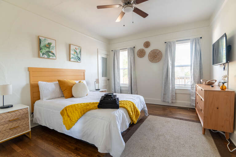 Relax in the master suite, boasting a flatscreen TV and a door to the private balcony for intimate evenings or peaceful morning views.