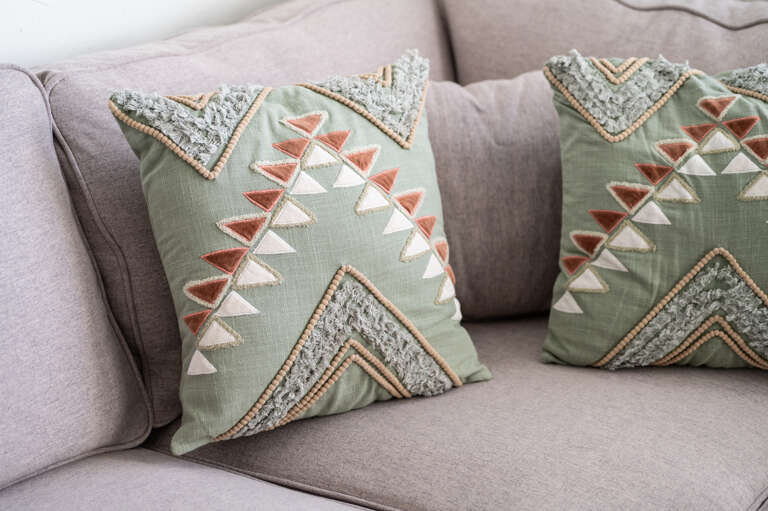 Cozy living room details with stylish pillows to enhance your stay. Cozy living room details with stylish pillows to enhance your stay.