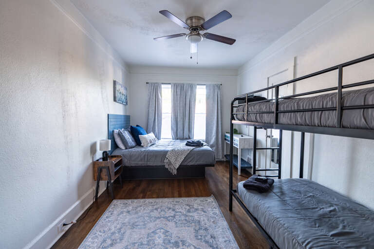 Another comfy sleep option with a queen bed and twin bunkbeds, ideal for families. 