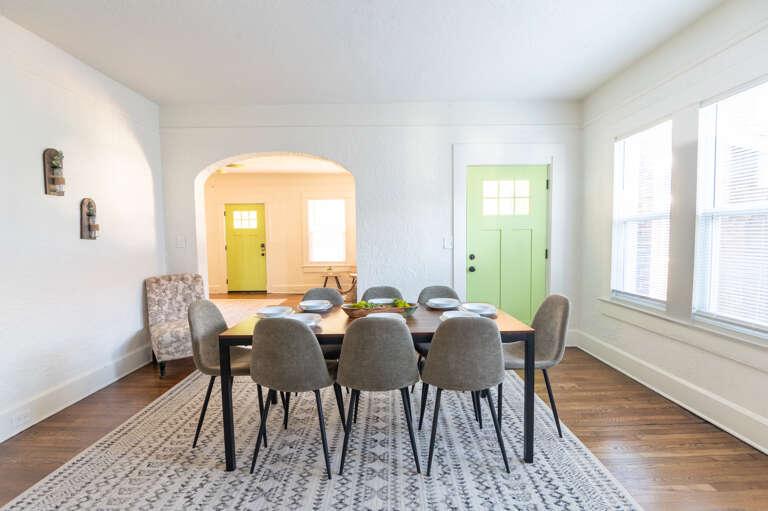 Dine with a view of not just your company but also the inviting outdoors, as seen through the side door leading to our serene patio.