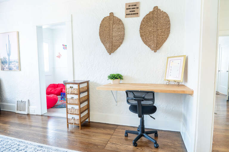 Inspiration flows easily in our dedicated workspace, featuring a friendly desk, comfy office chair, and a laptop-ready setup for your next big idea.