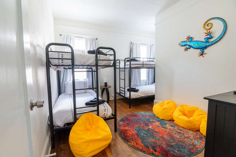 Our bunk room is a haven of fun, filled with bean bags for the ultimate chill-out zone, perfect for kids or the young at heart.