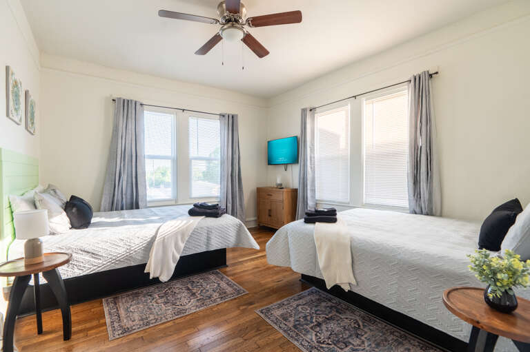 Dream sweet in our double queen room, complete with two cozy beds and a flatscreen TV. Ready for more adventures? Explore with Legacy Stays. www.legacystays.org