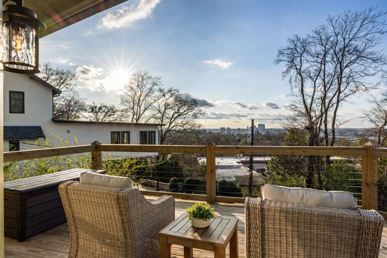 Relax in comfortable outdoor seating designed to embrace the stunning Birmingham cityscapes, blending urban beauty with serene comfort.