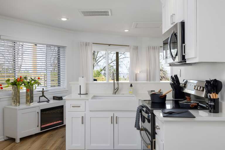 The kitchen, heart of the home, is equipped with modern appliances and all the essentials, ready for culinary adventures and shared meals.