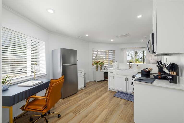 Craft your culinary masterpieces in a fully-equipped kitchen, complete with a fridge, stove, oven, and all the essential tools for creating unforgettable meals.