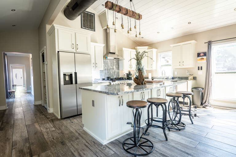 Unique bicycle-themed barstools adding a quirky touch to the kitchen island.
