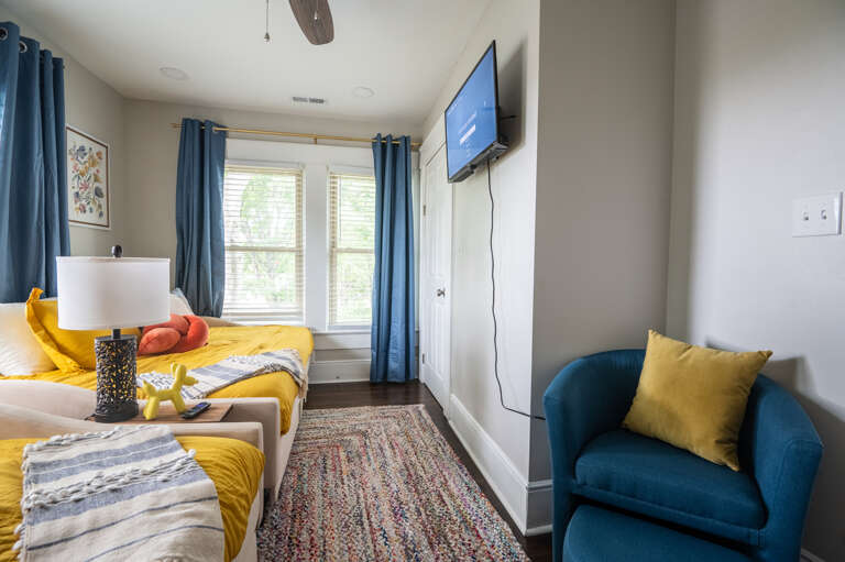 This inviting guest bedroom offers two full-sized daybeds complete with ample under-bed storage and a smart TV. Designed with both comfort and functionality in mind, your guests will feel right at home in this cozy and stylish room. This inviting guest bedroom offers two full-sized daybeds complete with ample under-bed storage and a smart TV. Designed with both comfort and functionality in mind, your guests will feel right at home in this cozy and stylish room.