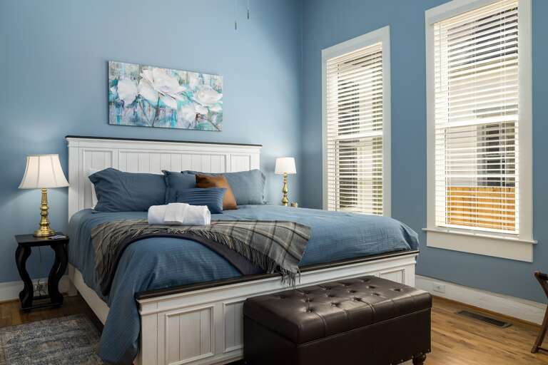 An additional view of the king bedroom showcases its elegant decor and ample space, ensuring a restful night's sleep.