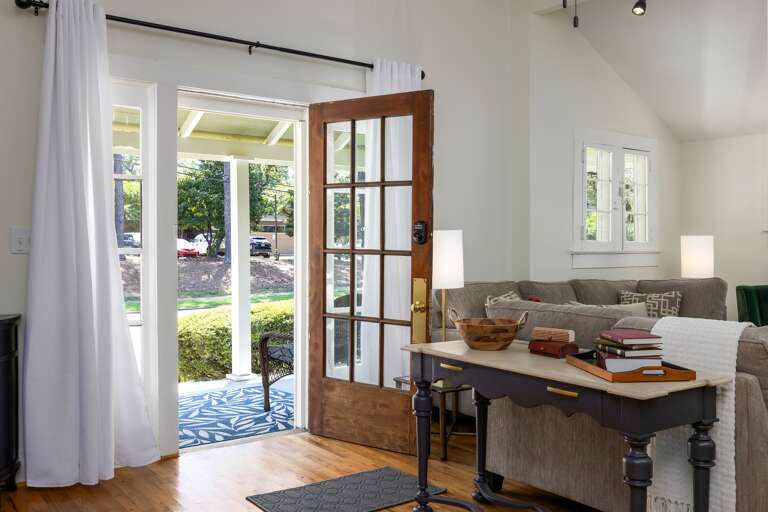 As you step into Summer Breeze, you're greeted by a bright and airy entryway. The space is decorated with a table to catch your keys, so you can relax and stay a while. 