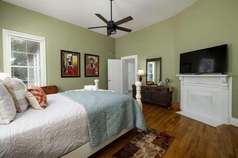 An additional view of the queen bedroom showcases its tasteful decor and ample natural light, making it a welcoming retreat.
