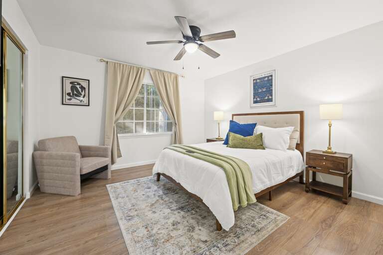 You will love the queen bedroom with plush bedding, comfy armchair, and blackout curtains for ultimate relaxation. Perfect for rest and rejuvenation in a serene setting. Ideal for travelers seeking comfort and tranquility.