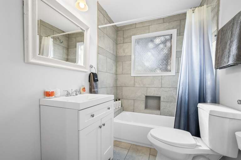 Full bath offers all essentials including soaps, towels, shampoo, conditioner, and body wash.