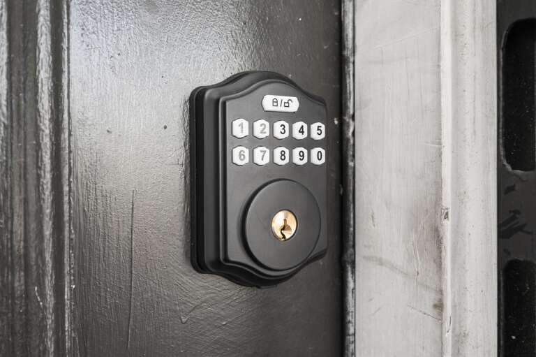Unit A main door with a smart lock for easy and secure access.