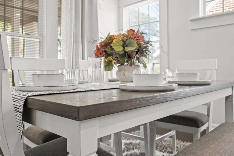 Dining area set for six, ideal for unwinding and enjoying dinner after a long Birmingham day.