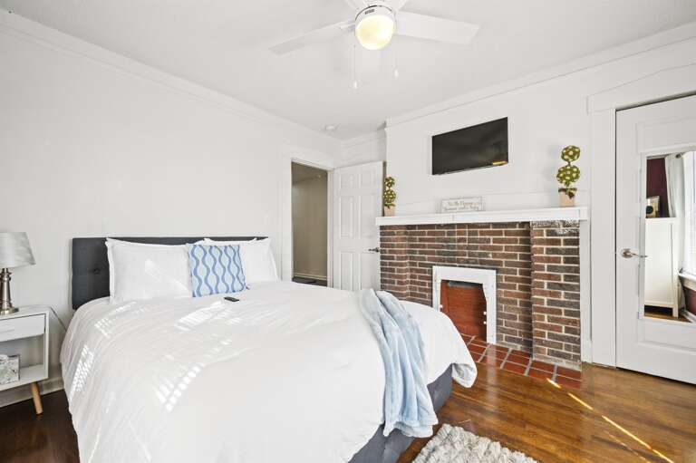 Master bedroom featuring a great queen bed, cozy comforter, and a smart TV for your entertainment and relaxation.