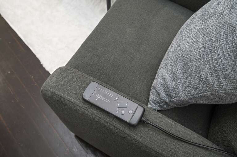 Unwind with the featured massage chair equipped with a convenient remote for relaxation. Unwind with the featured massage chair equipped with a convenient remote for relaxation.