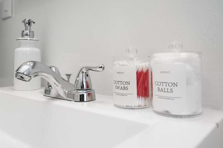 Thoughtful bathroom amenities including cotton balls and swabs, ensuring a comfortable stay. Thoughtful bathroom amenities including cotton balls and swabs, ensuring a comfortable stay.