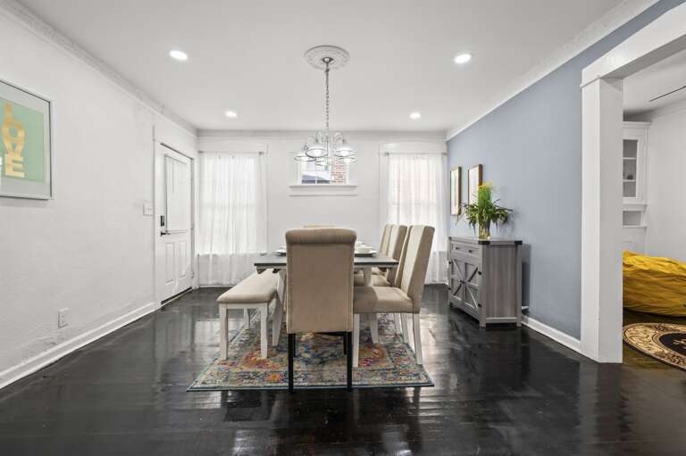 Elegant dining room transitions smoothly into the game room and living area.