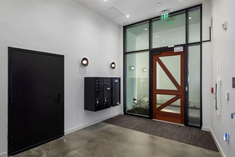 Sleek simplicity—the entrance lobby offers clean lines and modern touches, providing a quiet retreat from the bustling streets of downtown Birmingham.