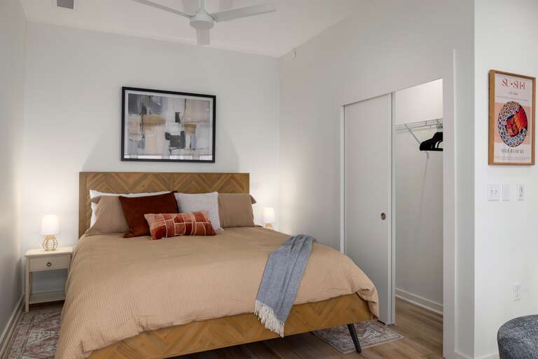 Ample storage—this bedroom provides not only a comfortable bed but also an easily accessible walk-in closet to store your belongings.