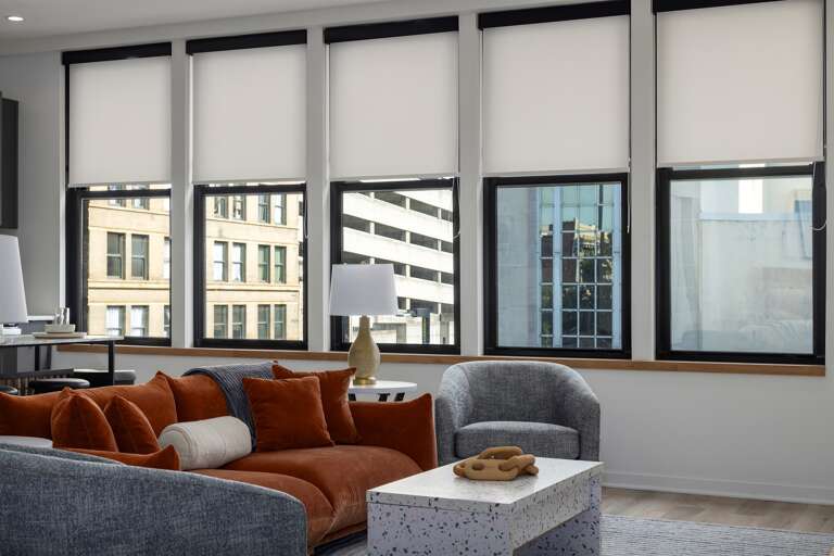 Entertainment ready—the flatscreen TV mounted on the wall offers easy viewing from the plush seating area, creating a perfect spot to catch up on your favorite shows or relax after a day of exploring.