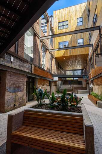 Gorgeous courtyard with modern beams, detailed wooden panels and tons of places to explore. Gorgeous courtyard with modern beams, detailed wooden panels and tons of places to explore.