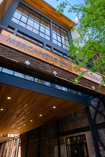 Infamous Mercantile on Morris sign. This front view of the Mercantile on Morris highlights its modern urban renewal, integrating historical brickwork with contemporary architectural elements. Infamous Mercantile on Morris sign. This front view of the Mercantile on Morris highlights its modern urban renewal, integrating historical brickwork with contemporary architectural elements.