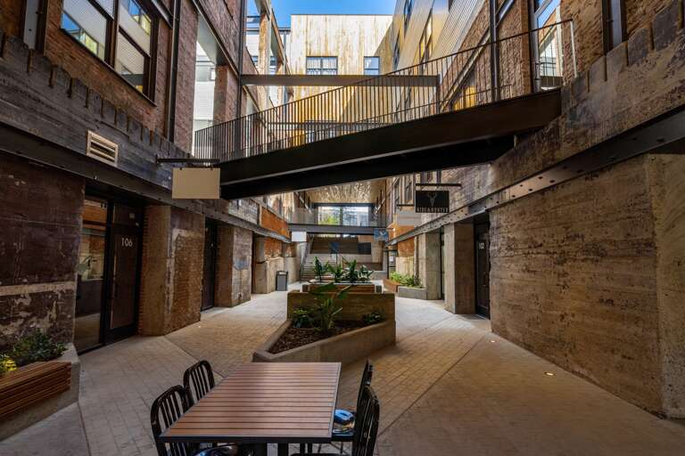 View from Morris Avenue. Your entrance can be either at the top of the concrete stairs, or the glass door just before the steps. View from Morris Avenue. Your entrance can be either at the top of the concrete stairs, or the glass door just before the steps.