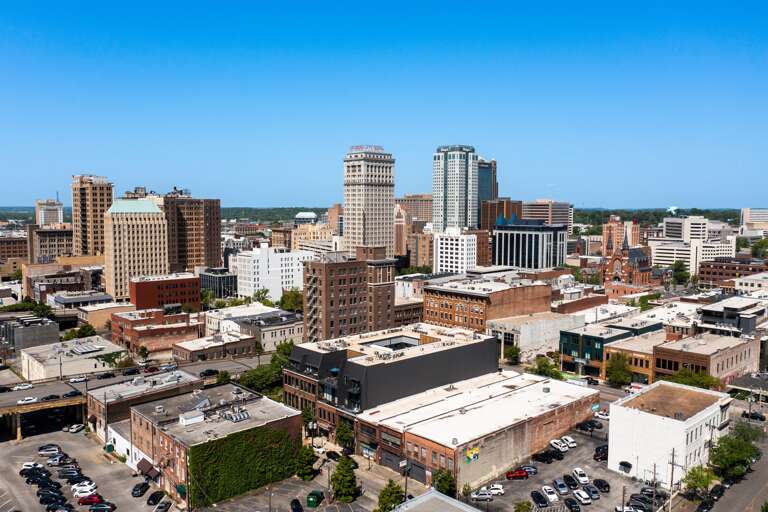 Showcasing a breathtaking aerial view of the city, this photo captures the urban landscape with its mix of historical and modern buildings. Showcasing a breathtaking aerial view of the city, this photo captures the urban landscape with its mix of historical and modern buildings.