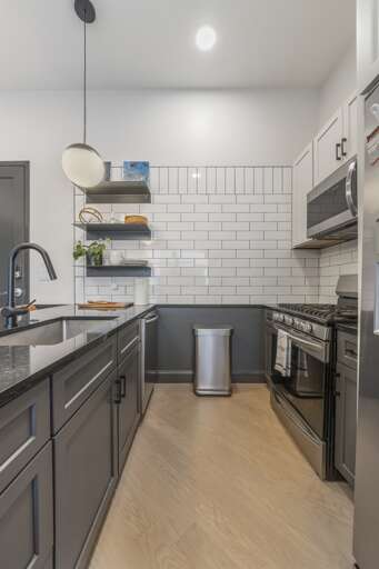 Designed for both style and functionality, this kitchen includes a chic dining bar with plush seating, ideal for enjoying a meal or sipping coffee in the morning light. Designed for both style and functionality, this kitchen includes a chic dining bar with plush seating, ideal for enjoying a meal or sipping coffee in the morning light.