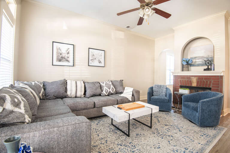 Spacious family room with ample seating and cozy touches, great for gathering together and making memories. Spacious family room with ample seating and cozy touches, great for gathering together and making memories.