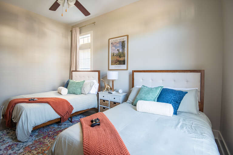 Cozy guest room with twin beds, perfect for families or friends traveling together. Cozy guest room with twin beds, perfect for families or friends traveling together.