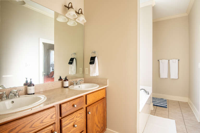 Dual sinks in the bathroom offer convenience for multiple guests.  Dual sinks in the bathroom offer convenience for multiple guests.