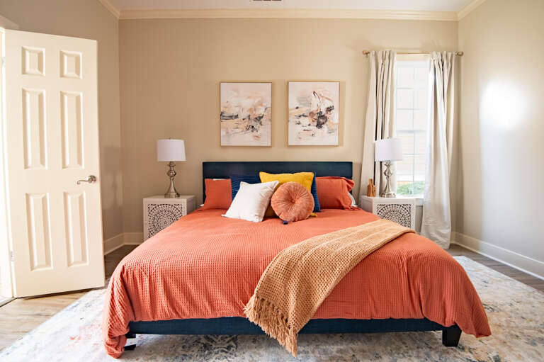 Stylish master bedroom with a plush bed and ample natural light. Stylish master bedroom with a plush bed and ample natural light.